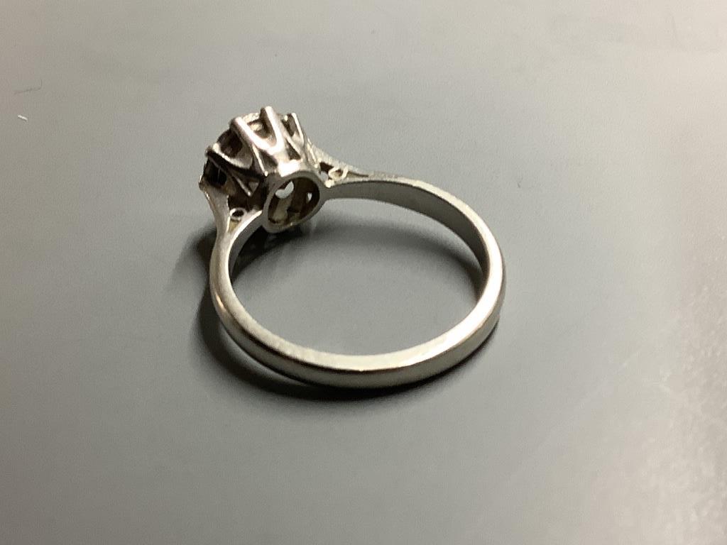 A white metal (stamped platinum) and solitaire diamond ring, size N, gross weight 4.5 g